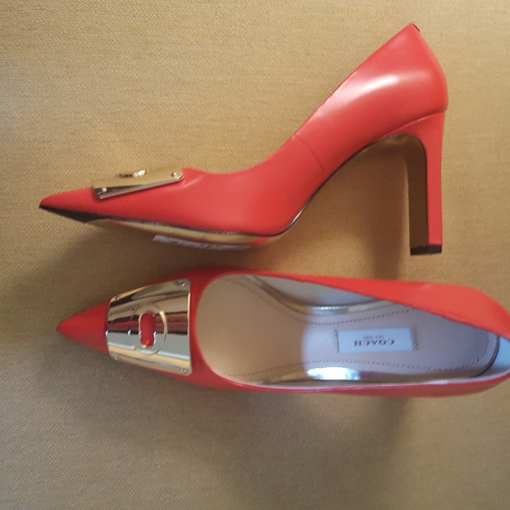 Red high heels by Coach